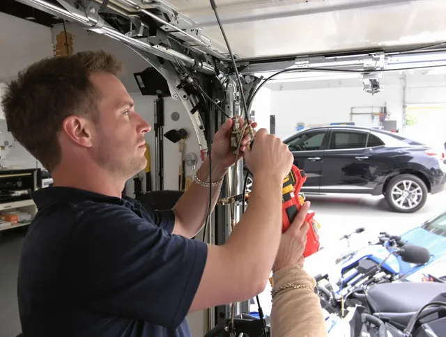 Cerritos Garage Door Repair safety certified technician performing cable replacement in Cerritos