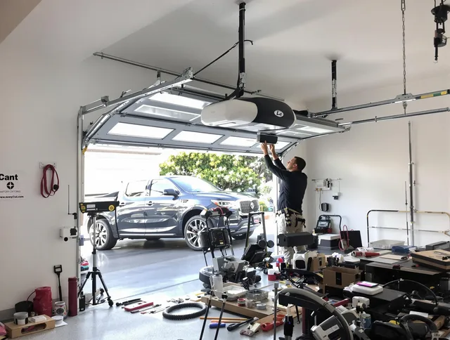 Cerritos Garage Door Repair specialist installing smart garage door opener system in Cerritos home